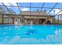 Enjoy the backyard with a screened-in pool and plenty of seating for outdoor relaxation at 1134 Glenwood Rd, Deland, FL 32720