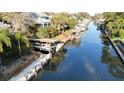 Scenic view of the waterway with boat docks lining the canal and lush greenery at 124 Godfrey Rd, Edgewater, FL 32141