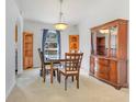 Traditional dining room featuring a wooden table, chairs, and a hutch at 154 Desiree Aurora St, Winter Garden, FL 34787