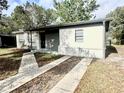 Straight on view of the front of the home featuring a black door at 2426 Barbarossa Ave, Deltona, FL 32738