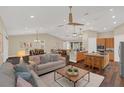 Bright, open-concept living area flows seamlessly into the kitchen and dining area at 255 Butterfly Forest Rd, Geneva, FL 32732