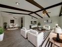 Bright and airy living room featuring vaulted ceilings and modern furnishings at 38 Emerald Ct, Ocala, FL 34472