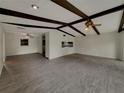 Bright and airy living room featuring vaulted ceilings and sleek flooring at 38 Emerald Ct, Ocala, FL 34472