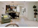 Open-concept living space flows into the dining area and kitchen with tile floors at 8141 Roseville Blvd, Davenport, FL 33896