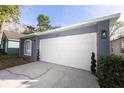 Well-maintained garage with a white door and decorative accents in a neutral paint scheme at 10142 Richardson Ct, Orlando, FL 32825