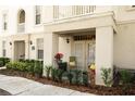 Welcome entrance with a cozy seating area, plants and a glass door at 1020 Siena Park W Blvd # 103, Celebration, FL 34747