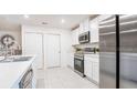 Bright kitchen with stainless steel appliances, white cabinetry, and ample counter space at 1304 Congo Dr, Kissimmee, FL 34759