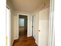 Hallway showing hardwood floors with a view into another room at 2394 Orange Center Blvd, Orlando, FL 32805