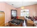 Dining room with a chandelier, a large window, and hardwood flooring at 2935 Willow Bay Ter, Casselberry, FL 32707