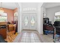 Bright foyer with decorative tile flooring and a double door entry at 2935 Willow Bay Ter, Casselberry, FL 32707