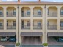 Multi-story condo building with covered parking and balconies at 706 Westpark Way # 203, Celebration, FL 34747