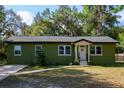 Charming single-story home with a well-maintained front yard, inviting entrance, and manicured landscaping at 9 Lake Dr, Debary, FL 32713