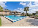 Community pool area with lounge chairs offers a refreshing outdoor space for relaxation and recreation at 165 N Pearl Lake Cswy # 202, Altamonte Springs, FL 32714