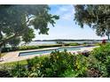 Resort-style pool area features an in-ground pool and scenic water views at 17201 Magnolia Island Blvd, Clermont, FL 34711