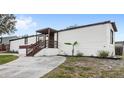 Charming single-story home with a cozy covered front porch and landscaped yard at 17529 Eve Dr, Montverde, FL 34756