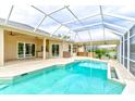 Screened in pool and spa offers a beautiful backyard escape with an outdoor kitchen and golf course views at 2439 Teton Stone Run, Orlando, FL 32828