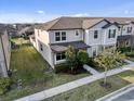 Charming townhome with manicured lawn, blooming shrubbery, and a well-maintained exterior at 2682 Mead Ave, St Cloud, FL 34771
