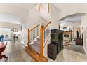 Inviting home entrance with a view of the fireplace and staircase at 302 Vista Loop, Davenport, FL 33897
