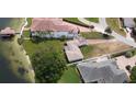 Aerial view of the property highlighting its lakeside location and surrounding landscape at 3045 Cecelia Dr, Apopka, FL 32703