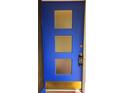 Striking blue front door with decorative glass panels and modern keypad entry at 420 W Crystal Dr, Sanford, FL 32773