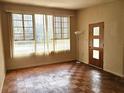 Bright living room with large window and unique parquet flooring at 420 W Crystal Dr, Sanford, FL 32773