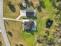 Overhead shot of home with pool, pond, guesthouse and long private driveway at 1220 Lake Mills Rd, Chuluota, FL 32766