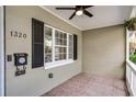 Cozy front porch featuring tiled flooring, a ceiling fan, and ample natural light at 1320 Golfview St, Orlando, FL 32804