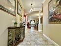 Inviting foyer with tile flooring, decorative console table, and views into living spaces at 13226 Zori Ln, Windermere, FL 34786