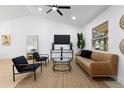 Stylish living room featuring a neutral color palette, modern decor, and ample natural light at 137 Stevens Ave, Chuluota, FL 32766