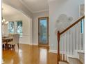 Foyer view of dining area with wooden floors and natural lighting at 13838 Walcott Ave, Orlando, FL 32827