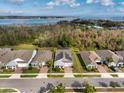 Aerial view of property with defined boundary, showcasing landscaping and proximity to lake at 2157 Bay Line Rd, Oakland, FL 34787