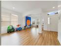 Bright and airy living room featuring wood floors, large windows, and an open concept design at 2502 Cypress Trace Cir, Orlando, FL 32825