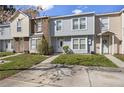 Well-kept townhome exteriors with green lawns and visible unit numbers at 483 Green Spring Cir, Winter Springs, FL 32708