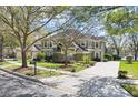 Beautiful two-story home with well-maintained landscaping and a long driveway at 490 Wekiva Preserve Dr, Apopka, FL 32712