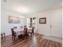 Bright dining room featuring hardwood floors, chandelier and decorative accents at 739 Annabell Ridge Rd, Minneola, FL 34715