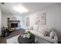 Cozy living room features a fireplace and comfortable seating at 8042 Tompkins Sq, Orlando, FL 32807