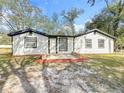 Up close exterior of the house with fresh paint and a nice brick entry way at 850 Rosalia Dr, Sanford, FL 32771