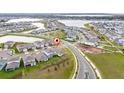 This aerial view highlights the community's layout with ponds, playgrounds and walking trails at 13270 Panama Beach Ct, Orlando, FL 32827