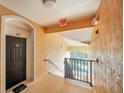 Hallway of condo featuring apartment number and exit sign at 13500 Turtle Marsh Loop # 839, Orlando, FL 32837