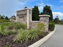 Stone monument sign for Preservation Pointe with lush landscaping at 1377 Sawgrass Hammock Ln, Davenport, FL 33837