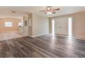 Spacious living room featuring modern gray flooring and a bright, open layout at 2021 Canal Rd, Deltona, FL 32738