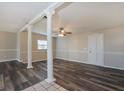 Inviting living room showcasing decorative pillars, gray floors, and neutral walls at 2021 Canal Rd, Deltona, FL 32738