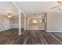 Bright living room with decorative pillars and a seamless flow into other spaces at 2021 Canal Rd, Deltona, FL 32738