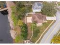 Aerial view of the home featuring the yard, water access, nearby homes, and landscaping at 2753 Joseph Cir, Oviedo, FL 32765