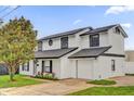 Beautiful two-story home features a well-manicured lawn and a attached garage at 2923 Cornell Ave, Orlando, FL 32804