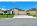 Beautiful single-story home featuring a two-car garage and landscaped front yard at 3504 Cayugas Loop, St Cloud, FL 34772