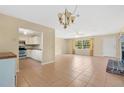 Inviting living room with tile floors, fireplace and open floorplan into the kitchen at 4898 Meadow Dr, St Cloud, FL 34772