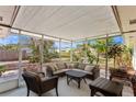 Relaxing screened-in patio furnished with comfortable seating, perfect for enjoying the outdoors at 4898 Meadow Dr, St Cloud, FL 34772