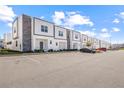 Row of modern townhomes with private parking and nice landscaping at 625 Trikomo Dr, Davenport, FL 33896