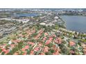 Aerial view of the community featuring red tile roofs and lush landscaping at 8218 Borgia Ct, Orlando, FL 32836